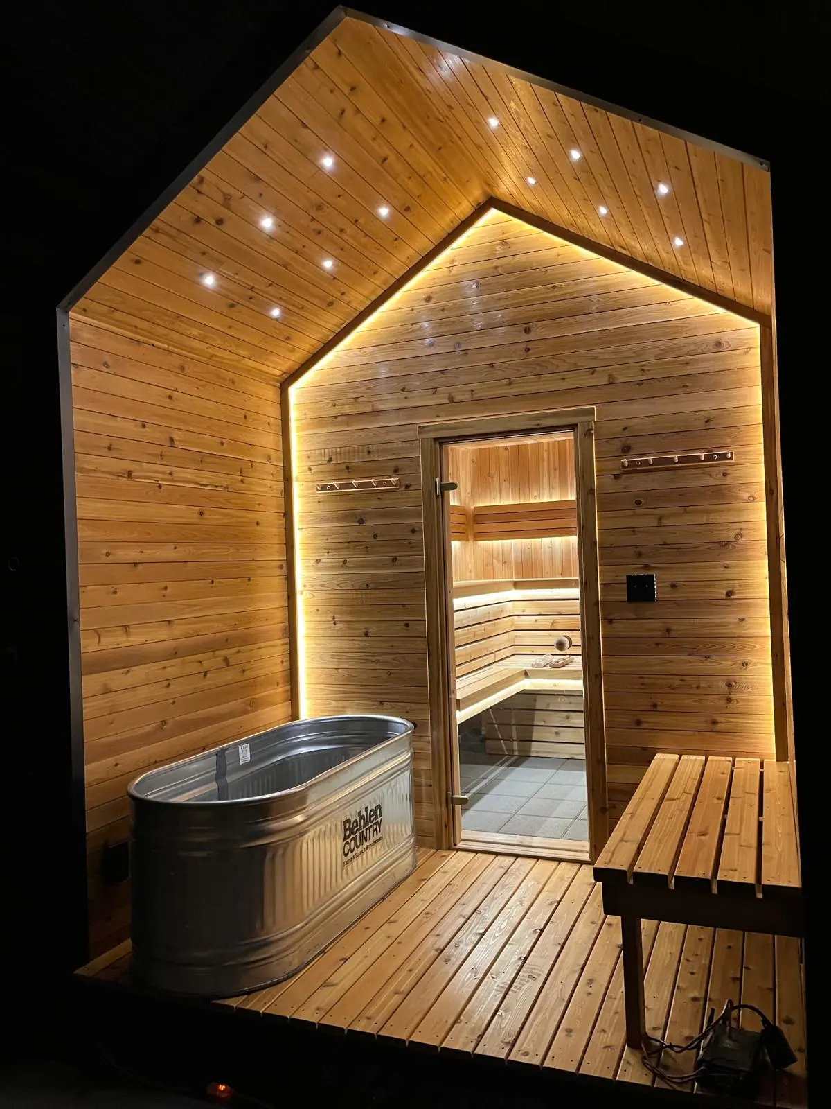 Pentagon porch at night with a cold plunge tub