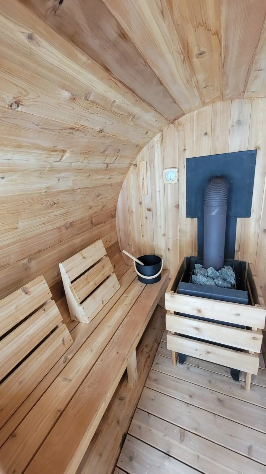 Rental barrel interior with wood stove