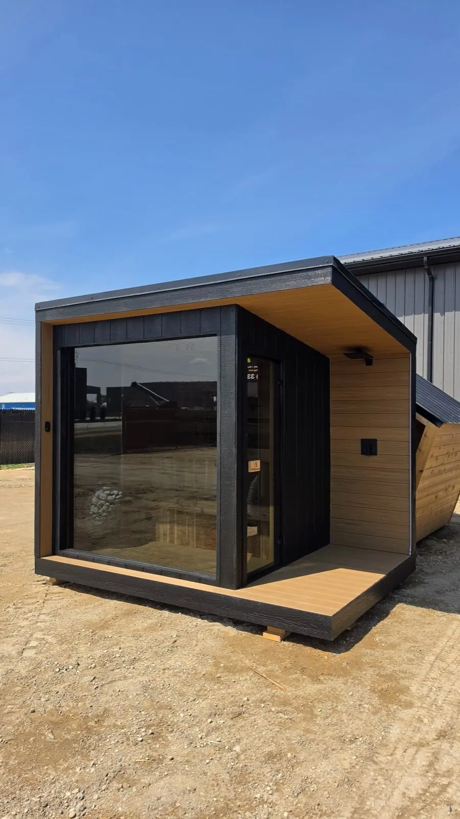 Cube sauna with glass front